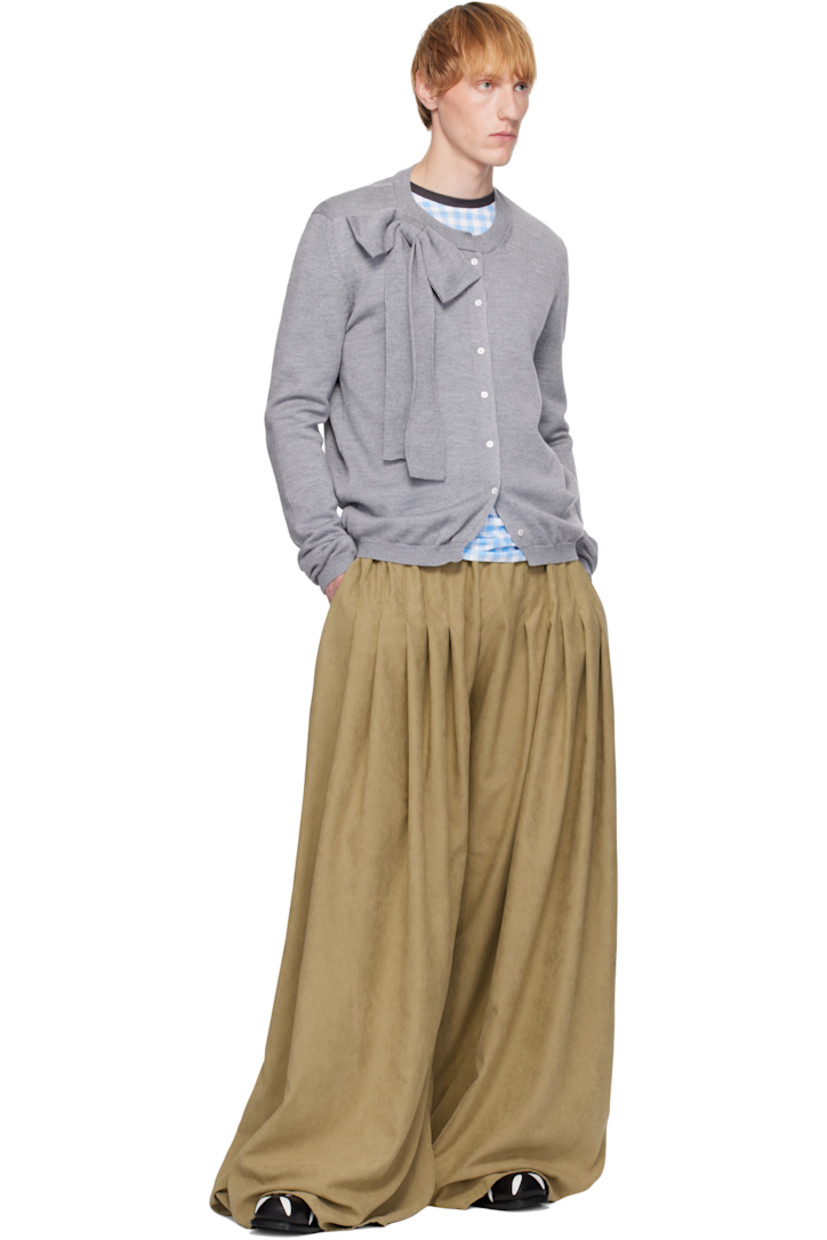 Knit merino wool cardigan.

· Rib-knit round neck, hem, and cuffs
· Bow appliqué at collar
· Button closure

Supplier color: Grey