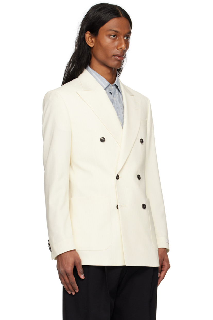 Wool twill blazer. 

· Peaked lapel
· Double-breasted button closure
· Patch pockets
· Padded shoulders
· Surgeon's cuffs
· Vents at back hem
· Welt pockets at interior
· Full satin lining

Supplier color: Light ivory