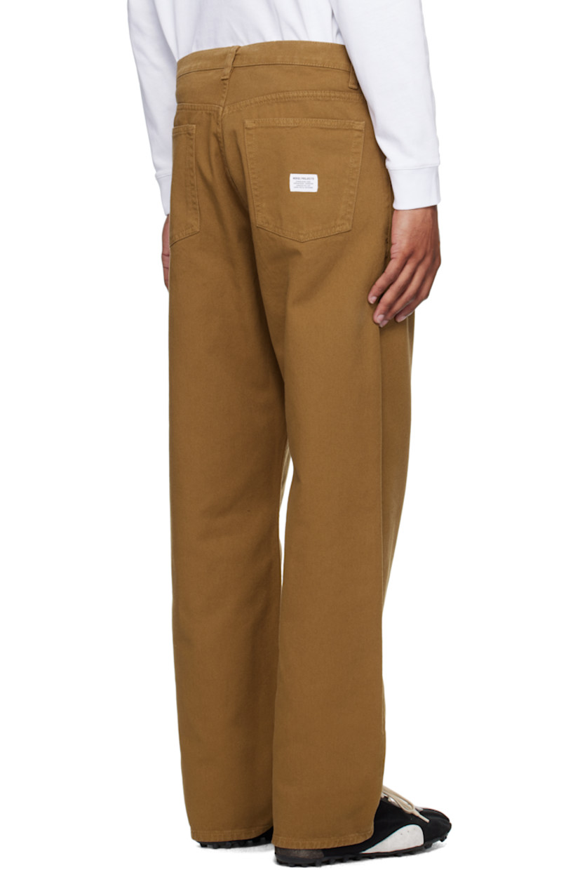 Loose-fit heavyweight 340 gsm cotton twill trousers.

· Garment-dyed
· High-rise
· Belt loops
· Five-pocket styling
· Zip fly
· Logo patch at back pocket

Supplier color: Duck