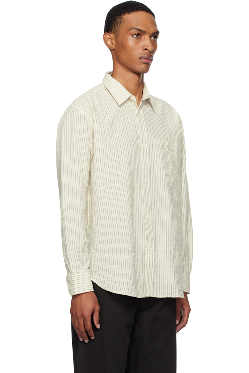 Stretch cotton-blend seersucker shirt. Stripes throughout.

· Spread collar
· Button closure
· Patch pocket at chest
· Shirttail hem
· Buttoned barrel cuffs
· Box pleat at back yoke

Supplier color: Chestnut