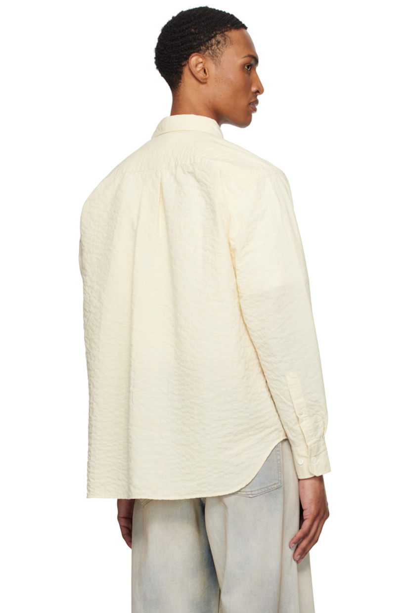 Stretch cotton-blend seersucker shirt. Check pattern throughout.

· Spread collar
· Button closure
· Patch pocket at chest
· Shirttail hem
· Buttoned barrel cuffs
· Box pleat at back yoke

Supplier color: Oatmeal