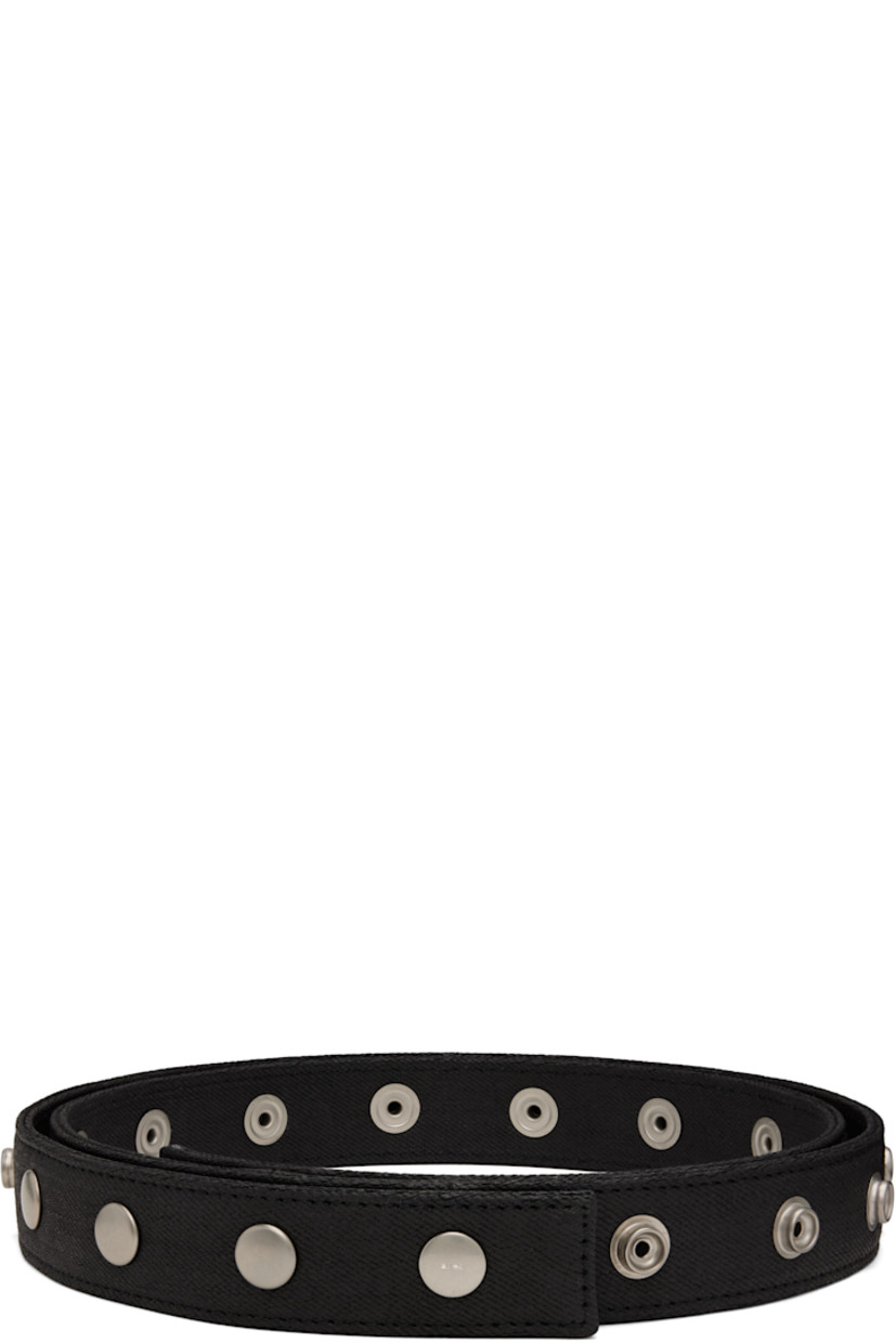 Overdyed and waxed 13 oz denim belt.

· ZDHC-certified wash
· Studs at length
· Press-stud fastening
· Silver-tone stainless steel hardware
· W1.25" 

Supplier color: Black/Black