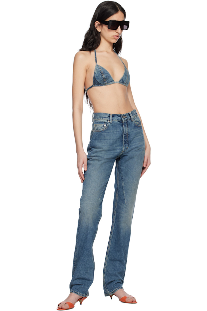 Garment-washed 13 oz non-stretch selvedge denim bra. Fading throughout.

· ZDHC-certified denim
· Self-tie halter strap
· Hook-eye fastening at back
· Full poplin lining
· Contrast stitching in tan

Supplier color: Washed indigo