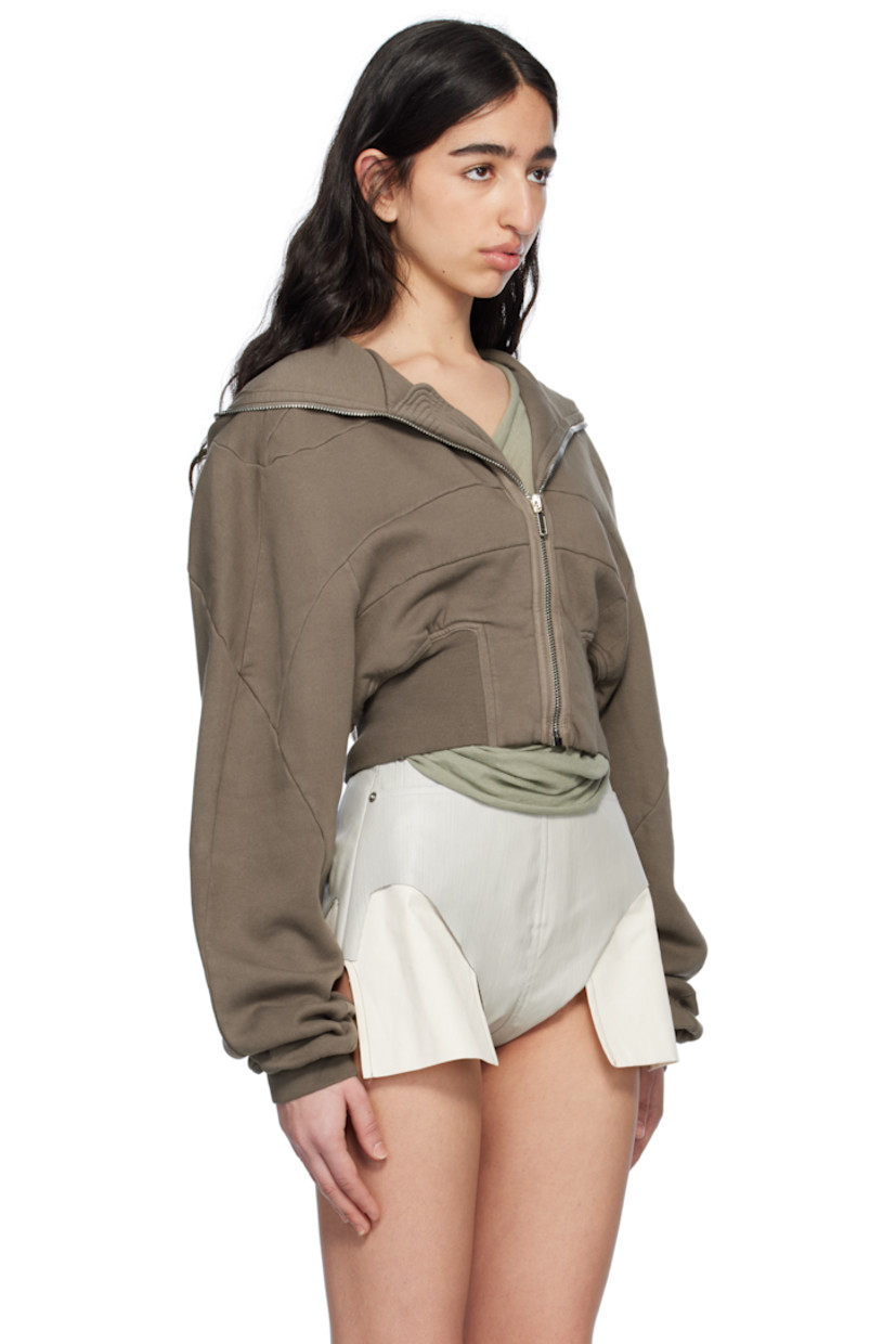 Heavyweight GOTS-certified organic cotton fleece hoodie.

· Garment-washed
· Paneled construction
· Zip closure extends to hood
· Rib-knit cropped hem and cuffs
· Dropped shoulders
· Logo-woven webbing strap at interior 

Supplier color: Dust