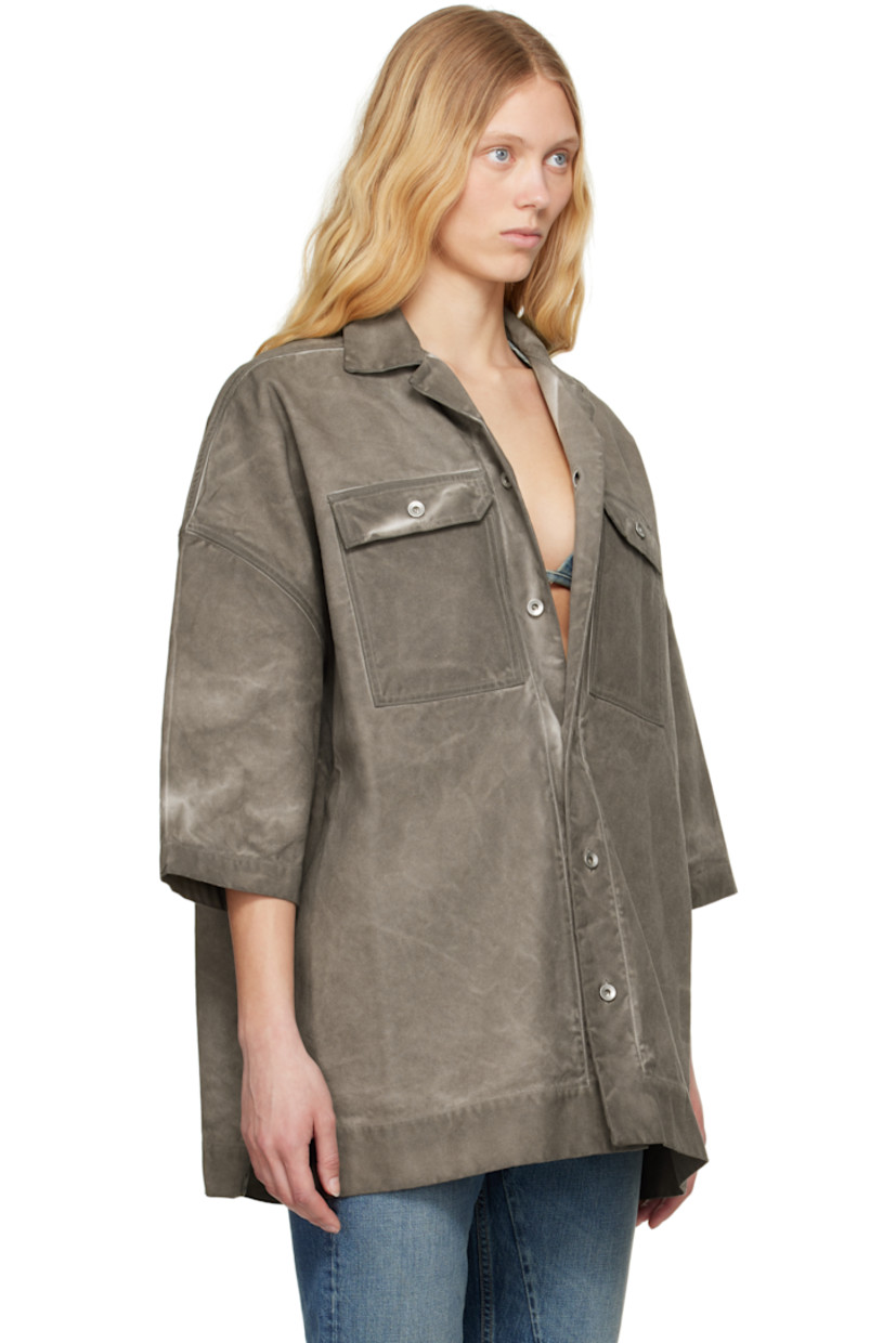 Foil-coated and garment-dyed organic cotton canvas shirt. Fading throughout.

· GOTS-certified organic cotton
· Open spread collar
· Button closure
· Flap pockets
· Logo-woven webbing strap at interior 

Each item is unique. Please note that coloration and finishing may vary.

Supplier color: Dust