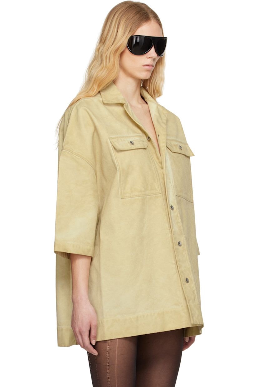 Foil-coated and garment-dyed organic cotton canvas shirt. Fading throughout.

· GOTS-certified organic cotton
· Open spread collar
· Button closure
· Flap pockets
· Logo-woven webbing strap at interior 

Each item is unique. Please note that coloration and finishing may vary.

Supplier color: Parchment
