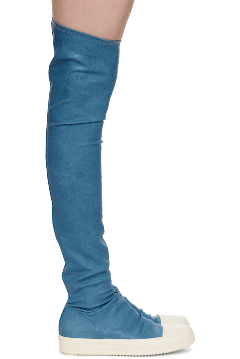 Over-the-knee 10 oz denim boots.

· ZDHC-certified
· Overdyed and foil-coated
· Rubber cap toe
· Gathering at vamp
· Elasticized collar
· Bonded jersey lining
· Treaded rubber sole

Supplier color: Toothpaste/Milk