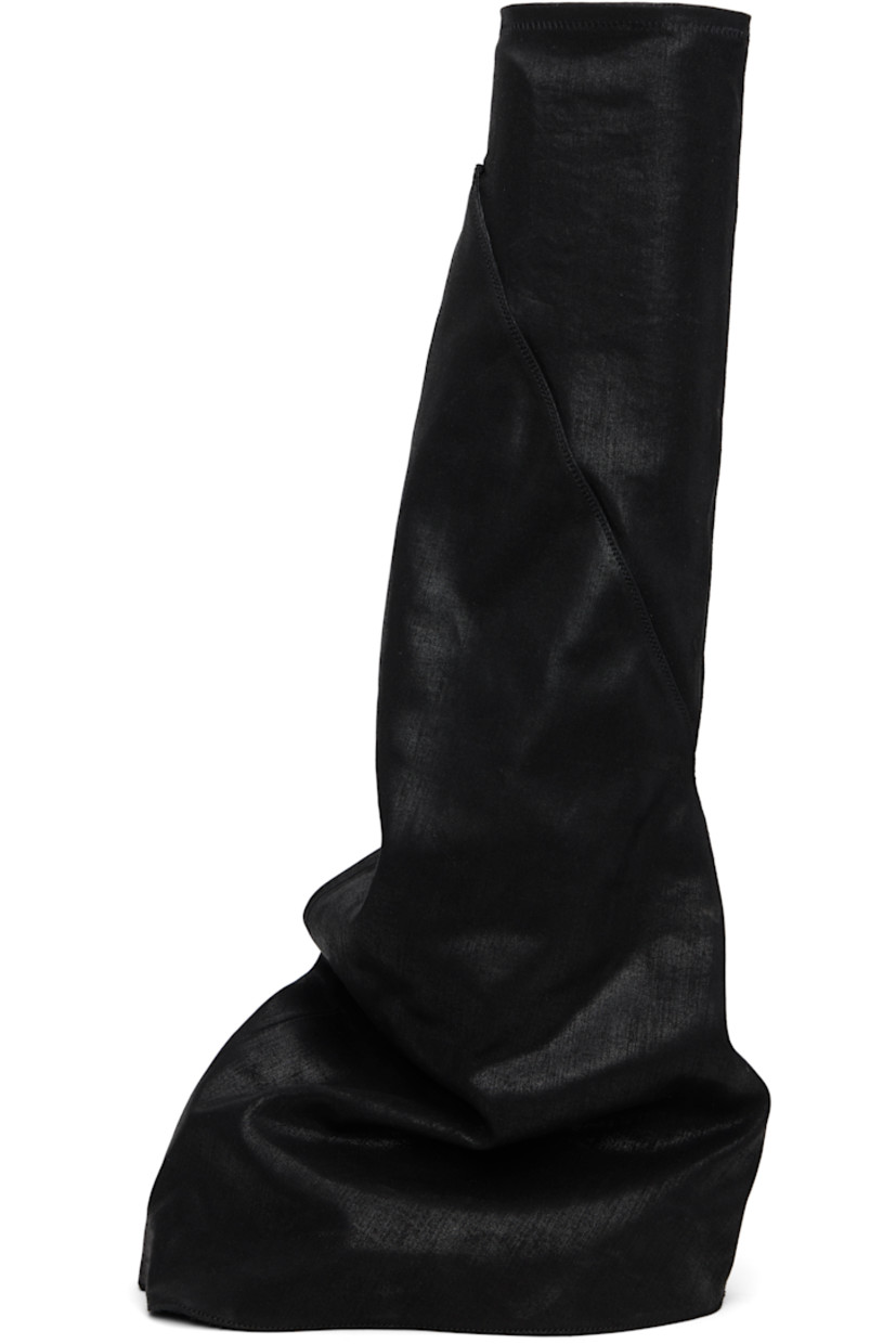 Thigh-high 13 oz denim boots.

· Overdyed and foil-coated
· ZDHC-certified denim
· Layered construction
· Concealed faux-leather cap toe
· Elasticized collar
· Treaded rubber sole

Supplier color: Black/Milk/Milk
