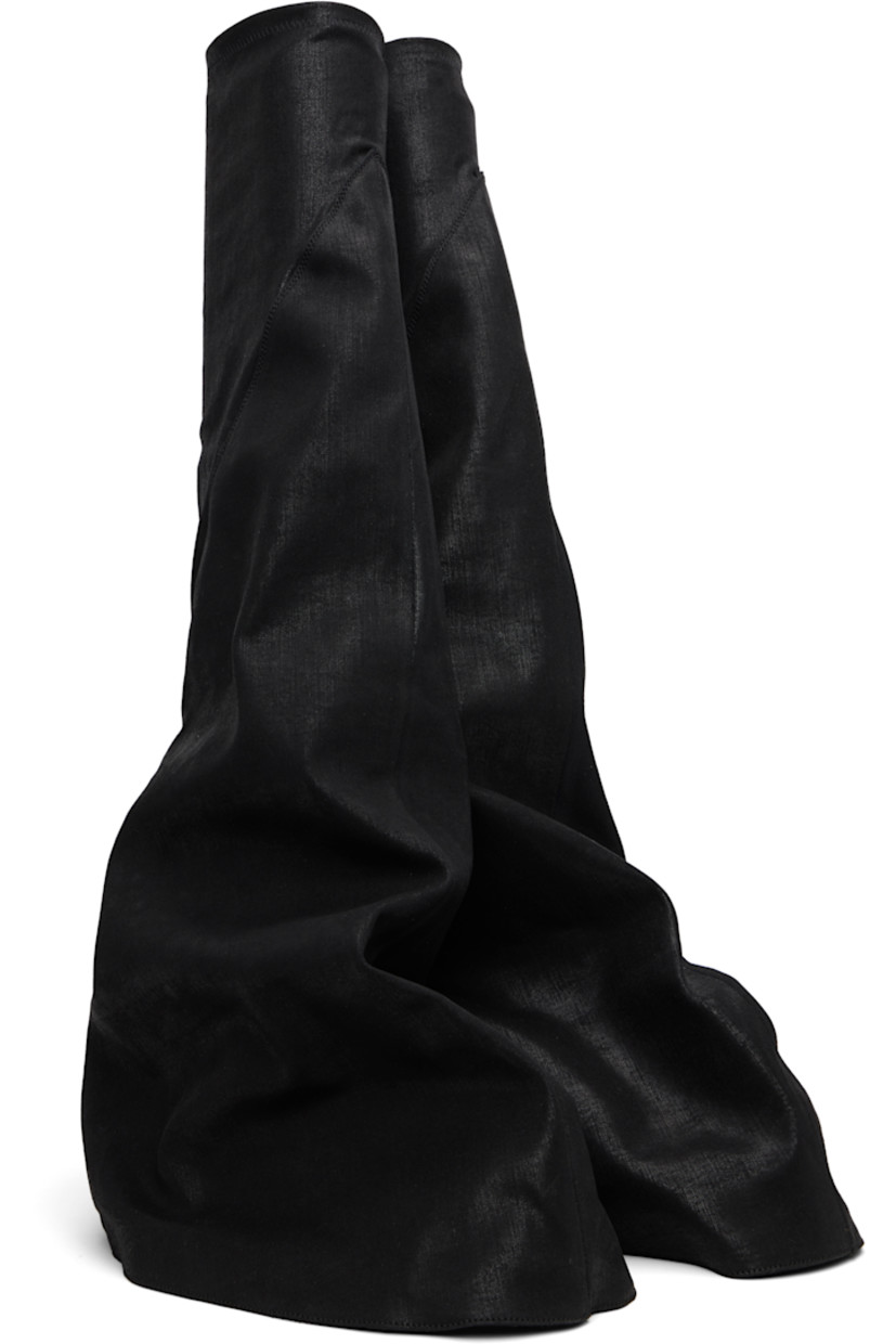Thigh-high 13 oz denim boots.

· Overdyed and foil-coated
· ZDHC-certified denim
· Layered construction
· Concealed faux-leather cap toe
· Elasticized collar
· Treaded rubber sole

Supplier color: Black/Milk/Milk