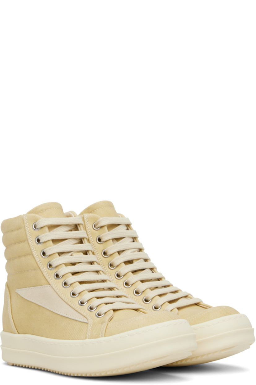 High-top GOTS-certified organic cotton canvas sneakers.

· Lace-up closure
· Padded and quilted collar
· Calfskin suede appliqué at sides
· Twill lining
· Treaded rubber sole

Supplier color: Parchment/Milk/Milk
