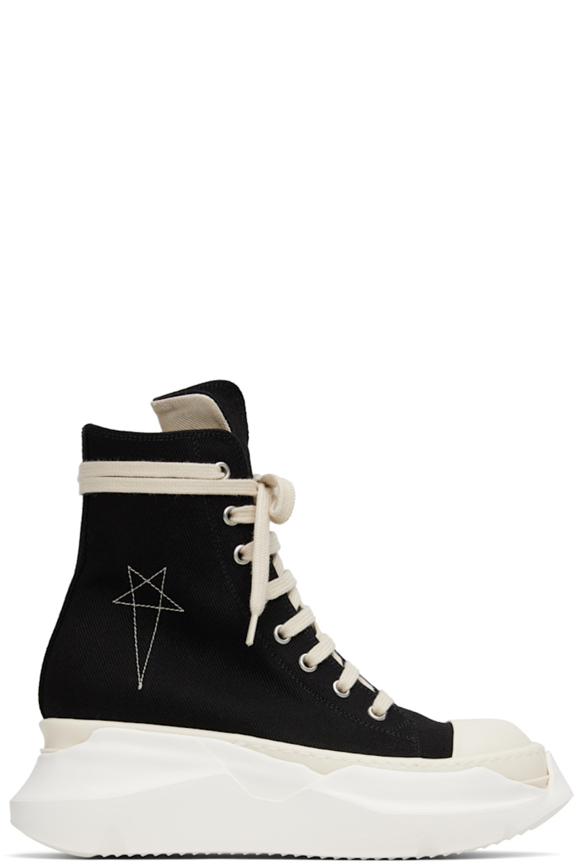 High-top denim sneakers.

· Faux-leather cap toe
· Lace-up closure
· Logo embroidered at outer side
· Zip closure and metal eyelets at inner side
· Sculptural rubber platform midsole
· Treaded rubber sole
· Platform: H2.5"

Supplier color: Black/Pearl/Milk