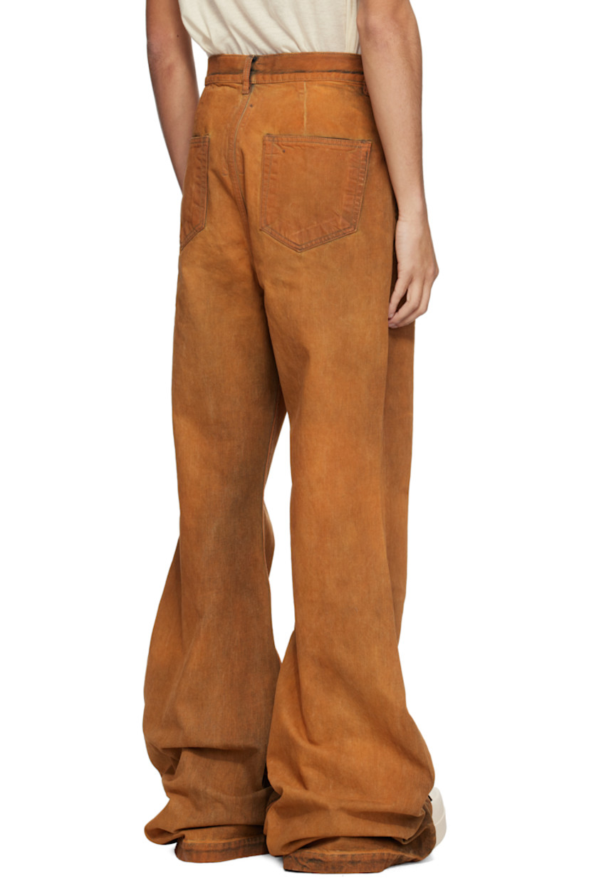 Overdyed 13 oz stretch selvedge denim jeans. Fading and whiskering throughout.

· ZDHC-certified denim
· Slim-fit and flared
· High-rise
· Belt loops
· Six-pocket styling
· Zip fly
· Extended hem
· Silver-tone hardware

Supplier color: Orange