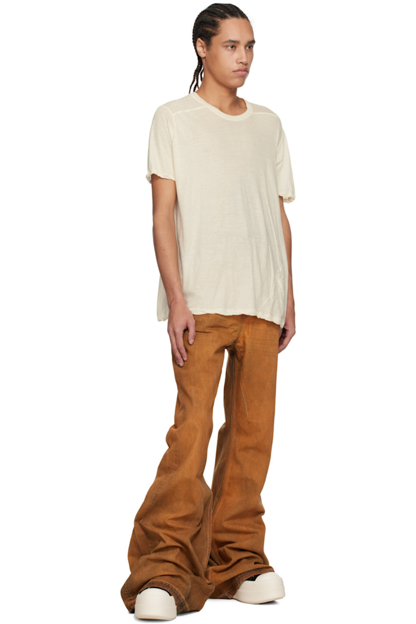 Overdyed 13 oz stretch selvedge denim jeans. Fading and whiskering throughout.

· ZDHC-certified denim
· Slim-fit and flared
· High-rise
· Belt loops
· Six-pocket styling
· Zip fly
· Extended hem
· Silver-tone hardware

Supplier color: Orange
