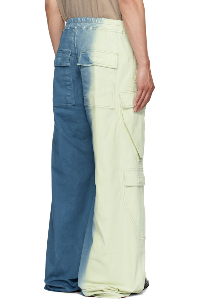 Overdyed 10 oz stretch denim cargo pants. Gradient throughout.

· ZDHC-certified
· Wide-leg
· Drawstring at elasticized waistband
· Four-pocket styling
· Exposed zip fly
· Eyelets and rivets at front
· Creased legs
· Extended hem
· Dropped inseam
· Cargo pockets at outseams

Supplier color: Toothpaste degrade