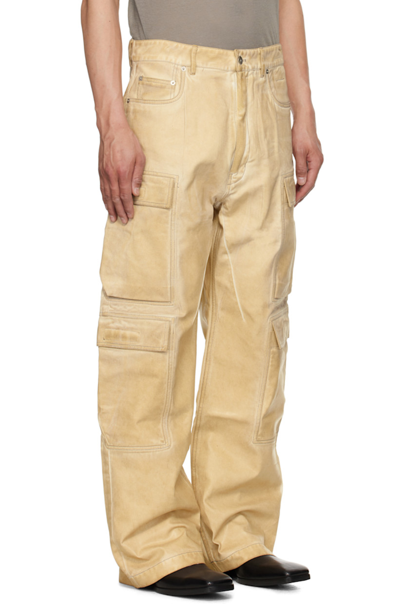 Overdyed and foil-coated 13 oz non-stretch organic cotton denim jeans. Fading throughout.

· GOTS- and ZDHC-certified
· Loose-fit
· Low-rise
· Belt loops
· Five-pocket styling
· Zip fly
· Cargo pockets at outseams 
· Contrast stitching in taupe

Each item is unique. Please note finishings may vary.

Supplier color: Parchment