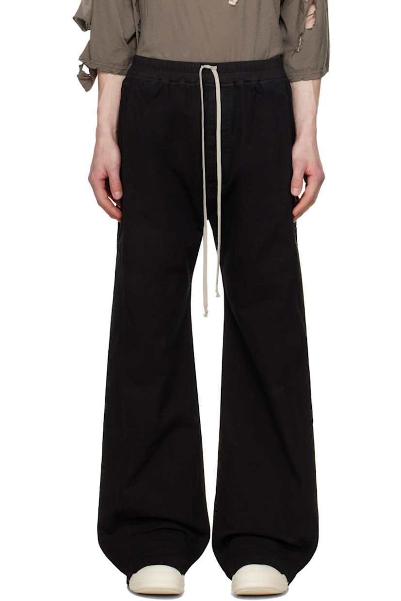 GOTS-certified organic cotton canvas sweatpants.

· Drawstring at elasticized poplin waistband
· Four-pocket styling
· Button fly
· Press-stud vent at outseams

Supplier color: Black