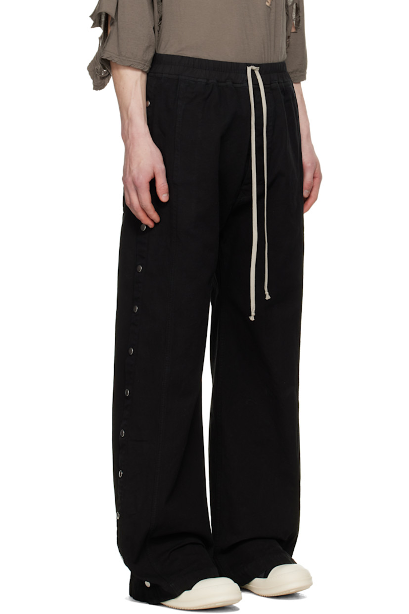 GOTS-certified organic cotton canvas sweatpants.

· Drawstring at elasticized poplin waistband
· Four-pocket styling
· Button fly
· Press-stud vent at outseams

Supplier color: Black