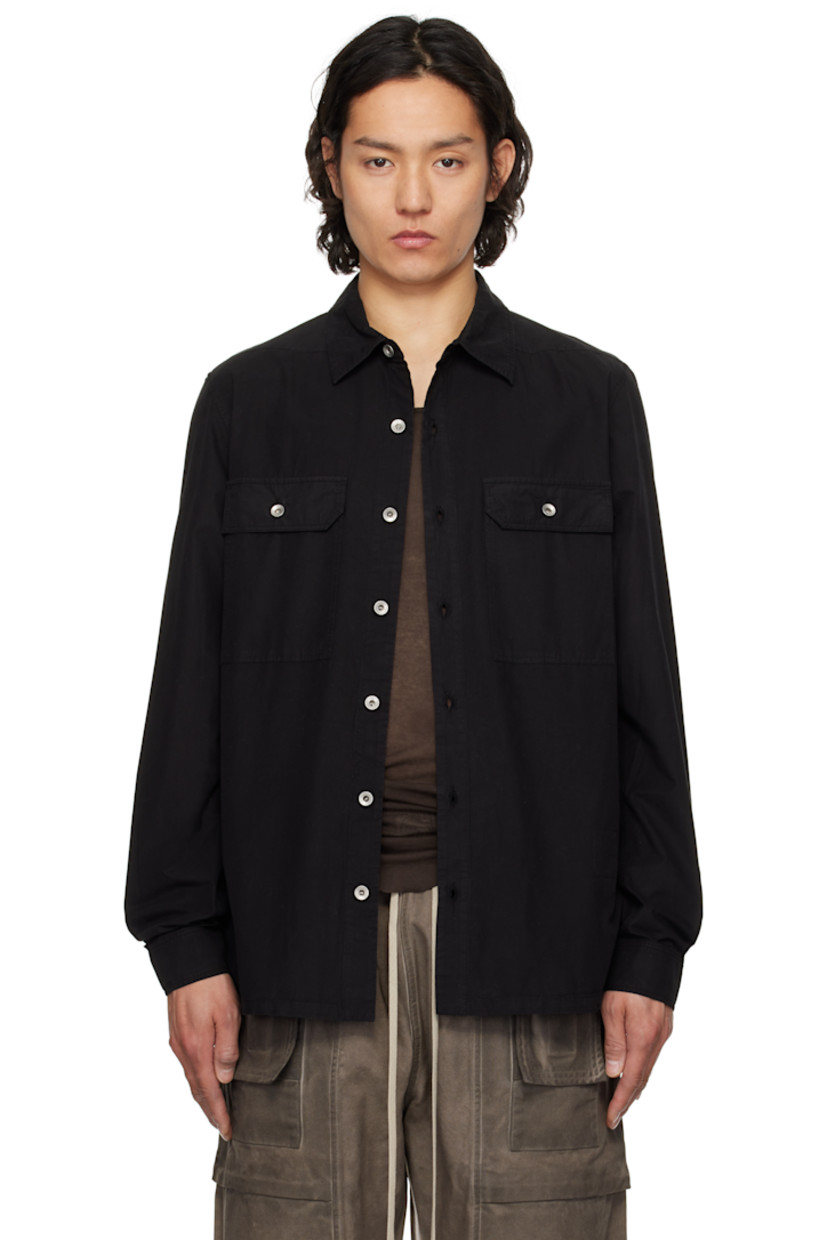 GOTS-certified organic cotton poplin overshirt.

· Garment-dyed
· Spread collar
· Button closure
· Flap pockets
· Droptail hem
· Beveled side seams
· Saddle shoulders
· Adjustable button fastening at cuffs
· Integrated logo-woven strap at interior
· Silver-tone hardware

Supplier color: Black
