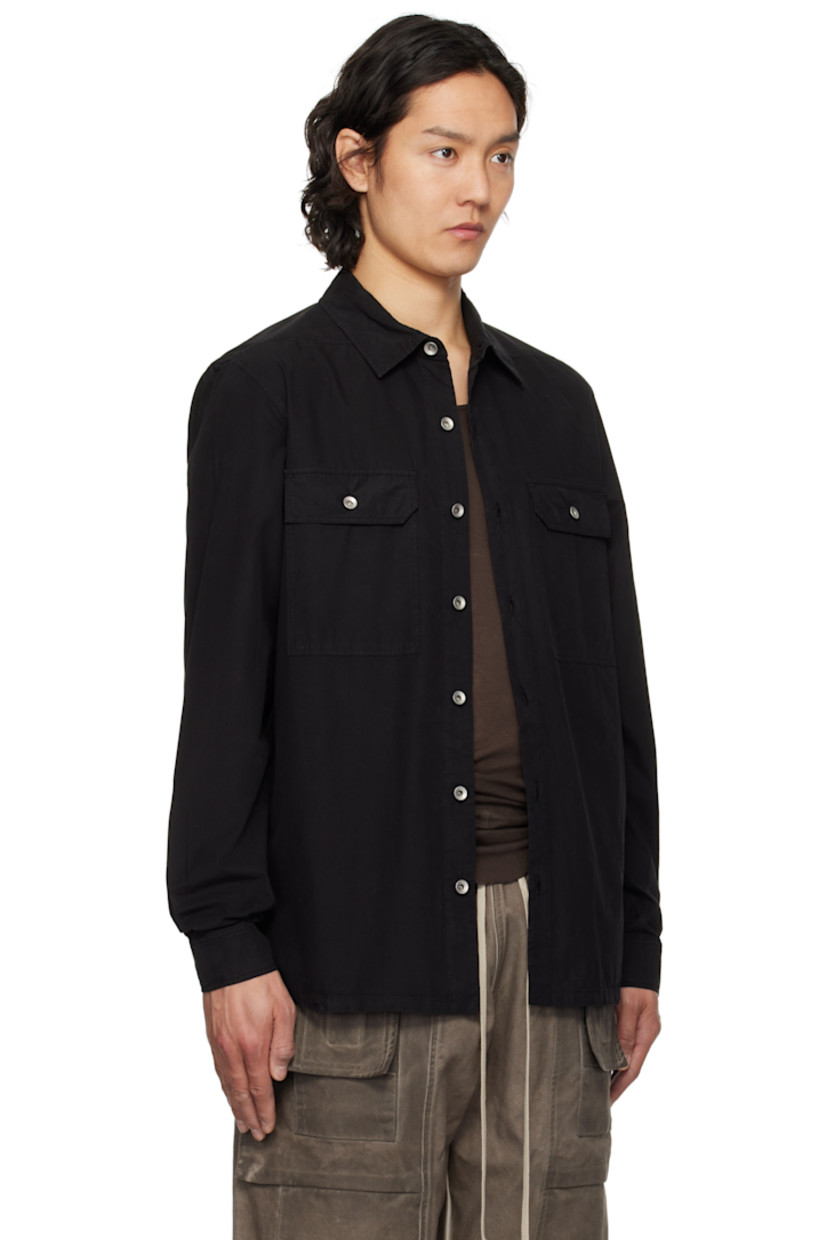 GOTS-certified organic cotton poplin overshirt.

· Garment-dyed
· Spread collar
· Button closure
· Flap pockets
· Droptail hem
· Beveled side seams
· Saddle shoulders
· Adjustable button fastening at cuffs
· Integrated logo-woven strap at interior
· Silver-tone hardware

Supplier color: Black