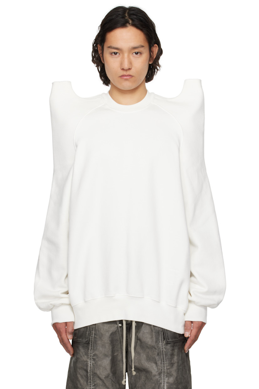 Heavyweight GOTS-certified organic cotton fleece sweatshirt.

· Rib-knit crewneck, hem, and cuffs
· Cutout with raw edge at pagoda shoulders
· Raglan sleeves
· Integrated logo-woven strap at interior

Supplier color: Milk
