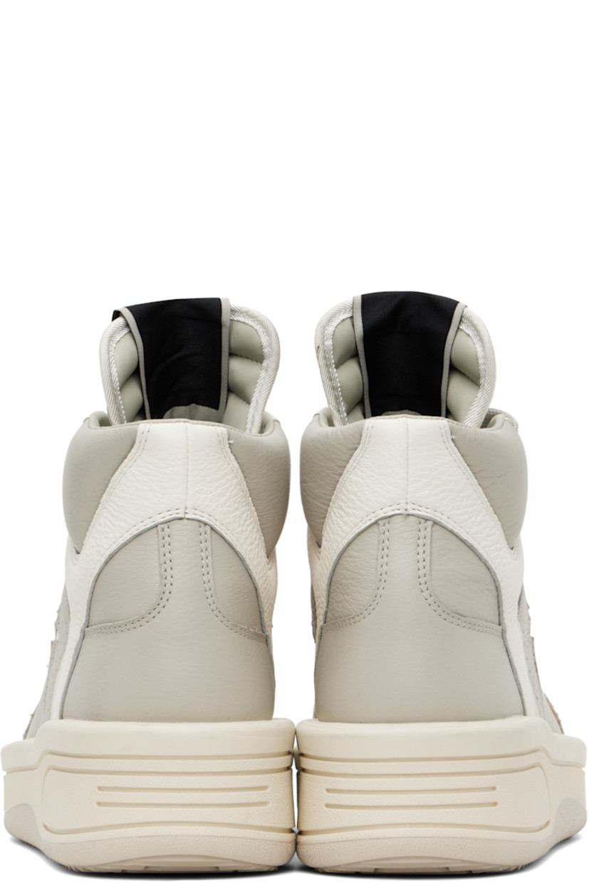 High-top grained leather sneakers in off-white.

· Perforated detailing throughout
· Lace-up closure
· Logo patch at padded tongue
· Padded collar
· Logo cutout at sides
· Buffed faux-leather lining
· Treaded rubber platform sole
· Platform: H2"

Part of the Rick Owens DRKSHDW x Converse collaboration.

Supplier color: Oyster/White