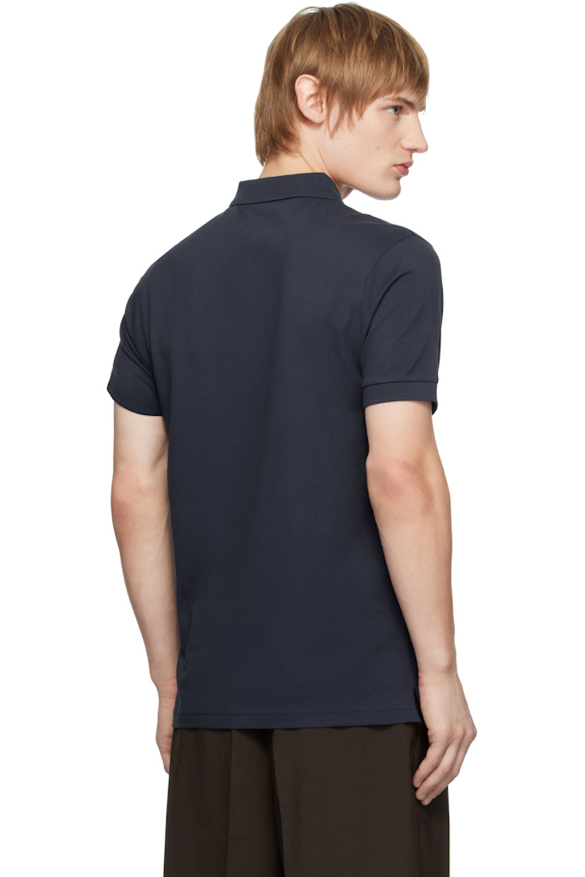 Supima cotton piqué polo. 

· Rib-knit spread collar and cuffs
· Two-button placket
· Tennis-tail hem
· Logo-engraved shell hardware

Supplier color: Navy