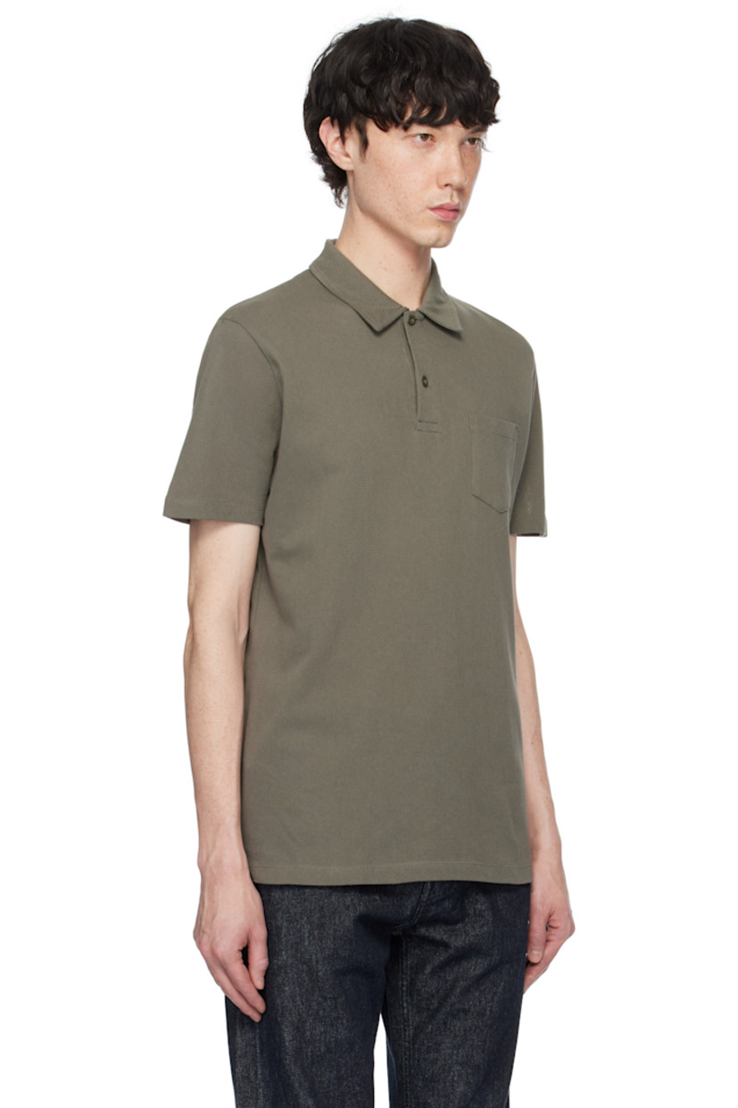 Lightweight extra-long staple supima cotton mesh polo. 

· Spread collar
· Two-button placket
· Patch pocket
· Vented side seams

Supplier color: Khaki