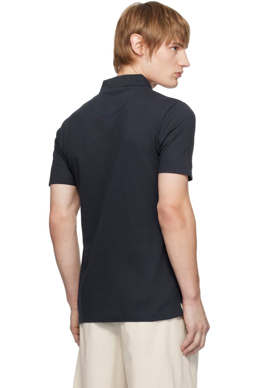 Extra-long staple Supima cotton mesh polo. Lightweight and breathable.

· Slim-fit
· Spread collar
· Two-button placket
· Patch pocket
· Tennis-tail hem

Supplier color: Navy