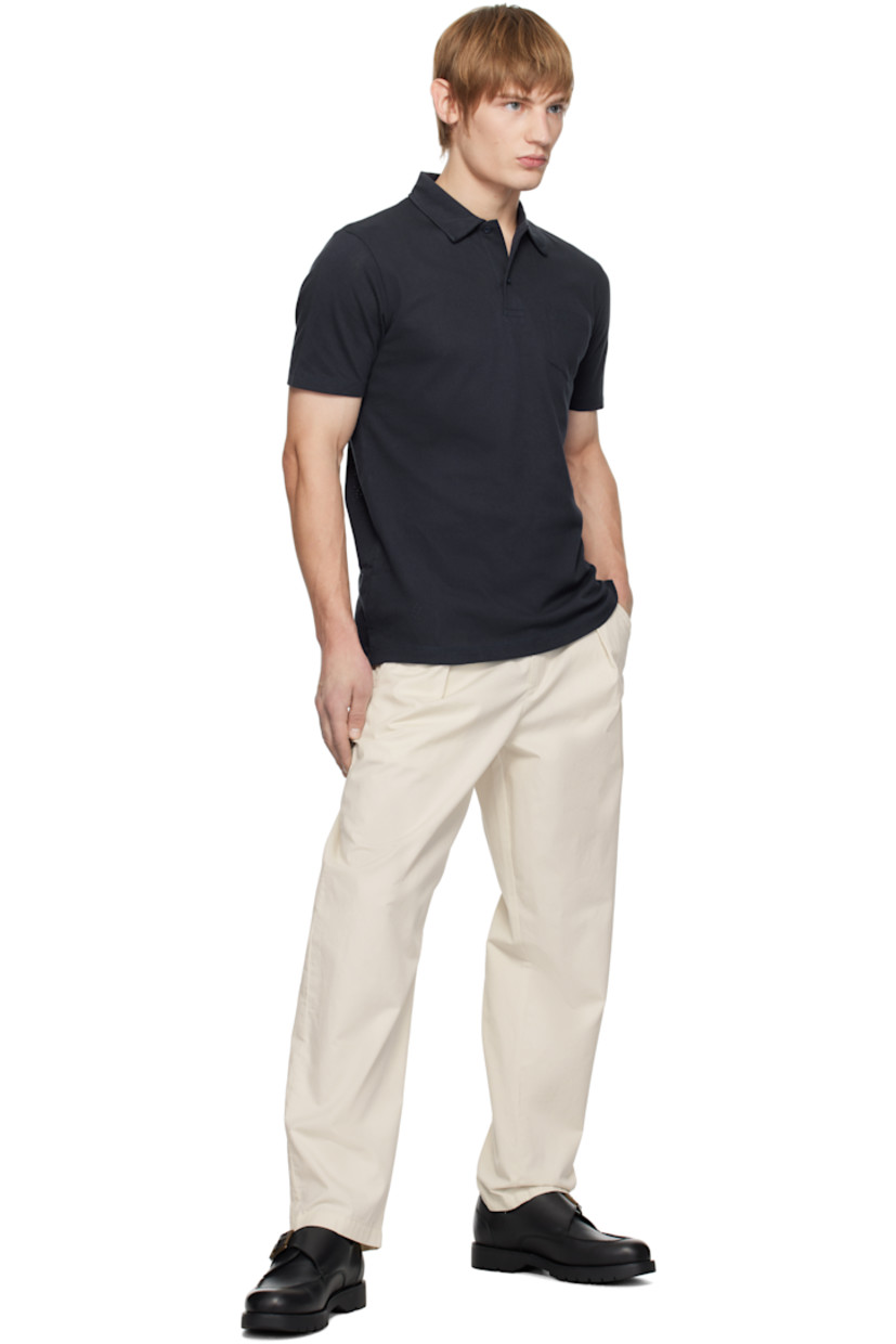 Extra-long staple Supima cotton mesh polo. Lightweight and breathable.

· Slim-fit
· Spread collar
· Two-button placket
· Patch pocket
· Tennis-tail hem

Supplier color: Navy