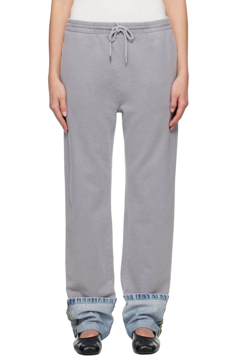 Cotton fleece lounge pants.

· Paneled construction
· Drawstring at elasticized waistband
· Three-pocket styling
· Rolled denim panel at cuffs
· Logo printed at back pocket
· Logo-engraved silver-tone hardware

Supplier color: Multi grey