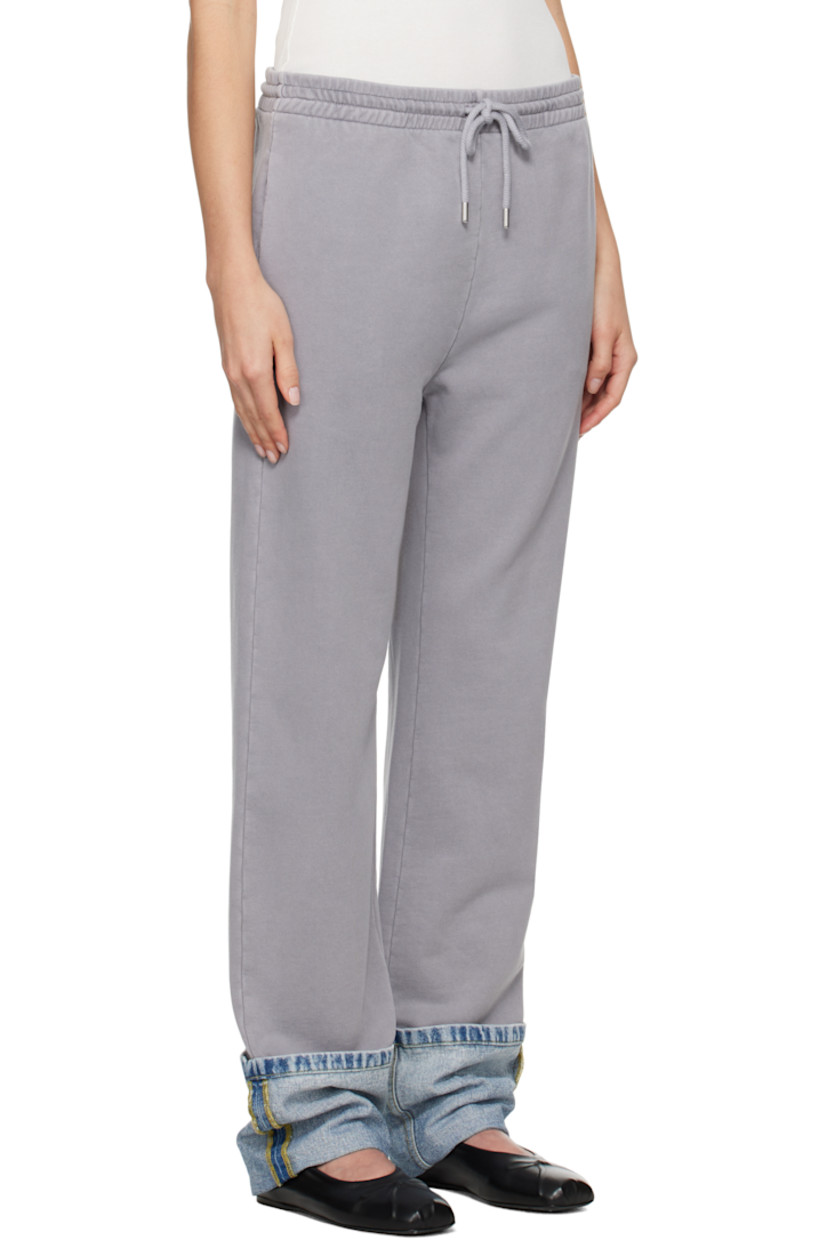 Cotton fleece lounge pants.

· Paneled construction
· Drawstring at elasticized waistband
· Three-pocket styling
· Rolled denim panel at cuffs
· Logo printed at back pocket
· Logo-engraved silver-tone hardware

Supplier color: Multi grey