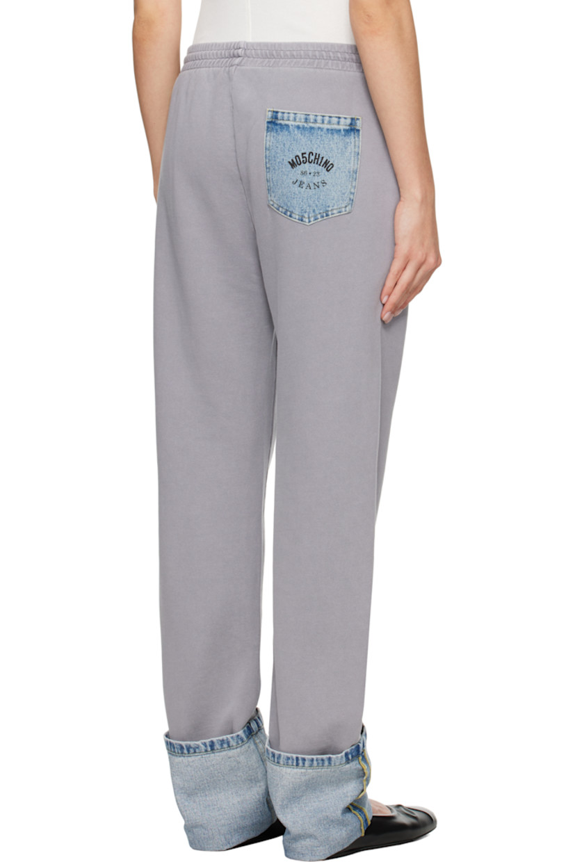 Cotton fleece lounge pants.

· Paneled construction
· Drawstring at elasticized waistband
· Three-pocket styling
· Rolled denim panel at cuffs
· Logo printed at back pocket
· Logo-engraved silver-tone hardware

Supplier color: Multi grey