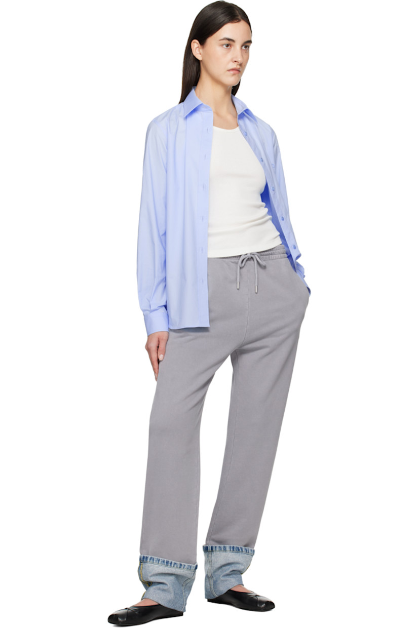 Cotton fleece lounge pants.

· Paneled construction
· Drawstring at elasticized waistband
· Three-pocket styling
· Rolled denim panel at cuffs
· Logo printed at back pocket
· Logo-engraved silver-tone hardware

Supplier color: Multi grey