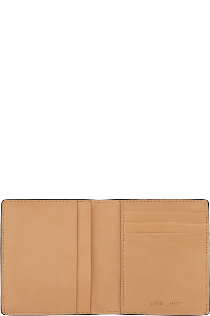Grained calfskin bifold wallet in black.

· Logo stamp at back face
· Three card slots
· Three patch pockets
· Moiré lining
· H4.5" x W3" x D0.25"

Supplier color: Black