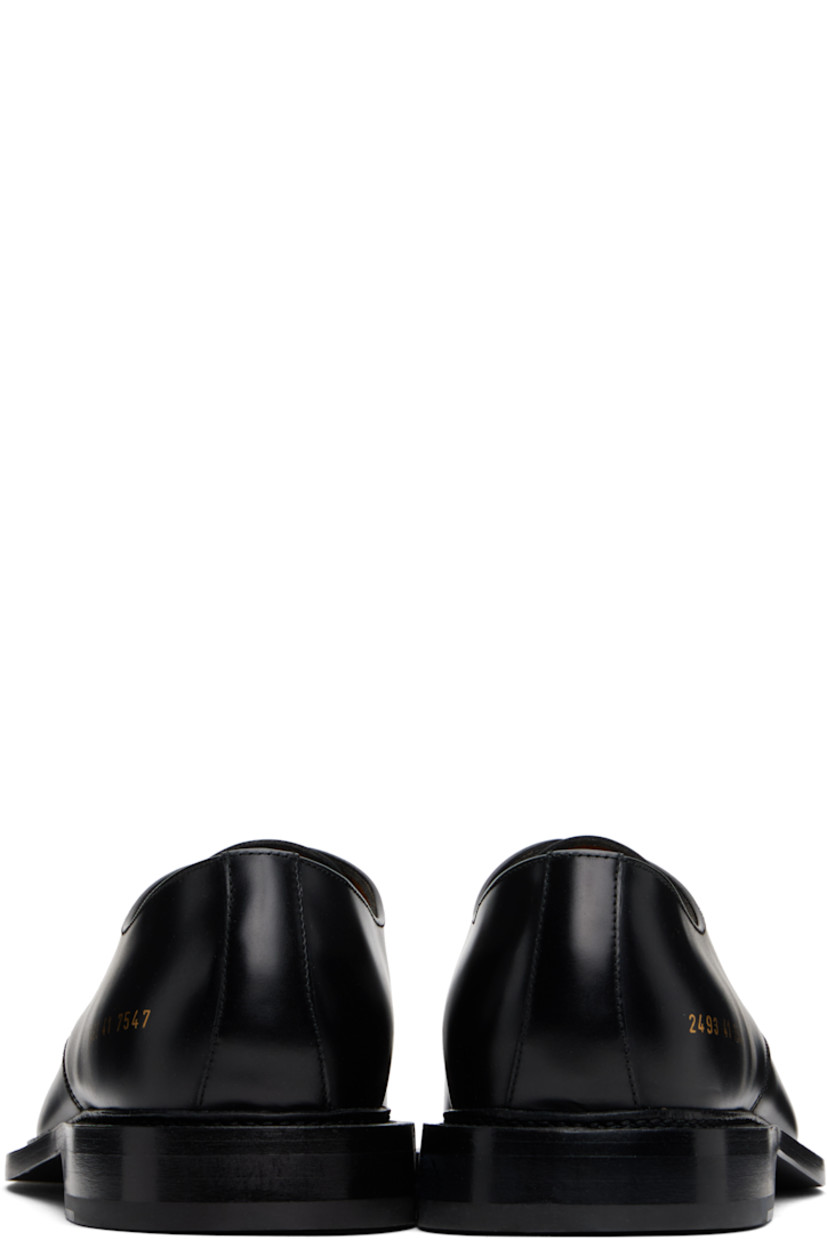 Polished leather derbys in black.

· Almond toe
· Lace-up closure
· Signature series stamp at outer side
· Buffed leather and suede lining
· Topstitching at welt
· Stacked leather heel with rubber injection
· Leather sole

Supplier color: Black