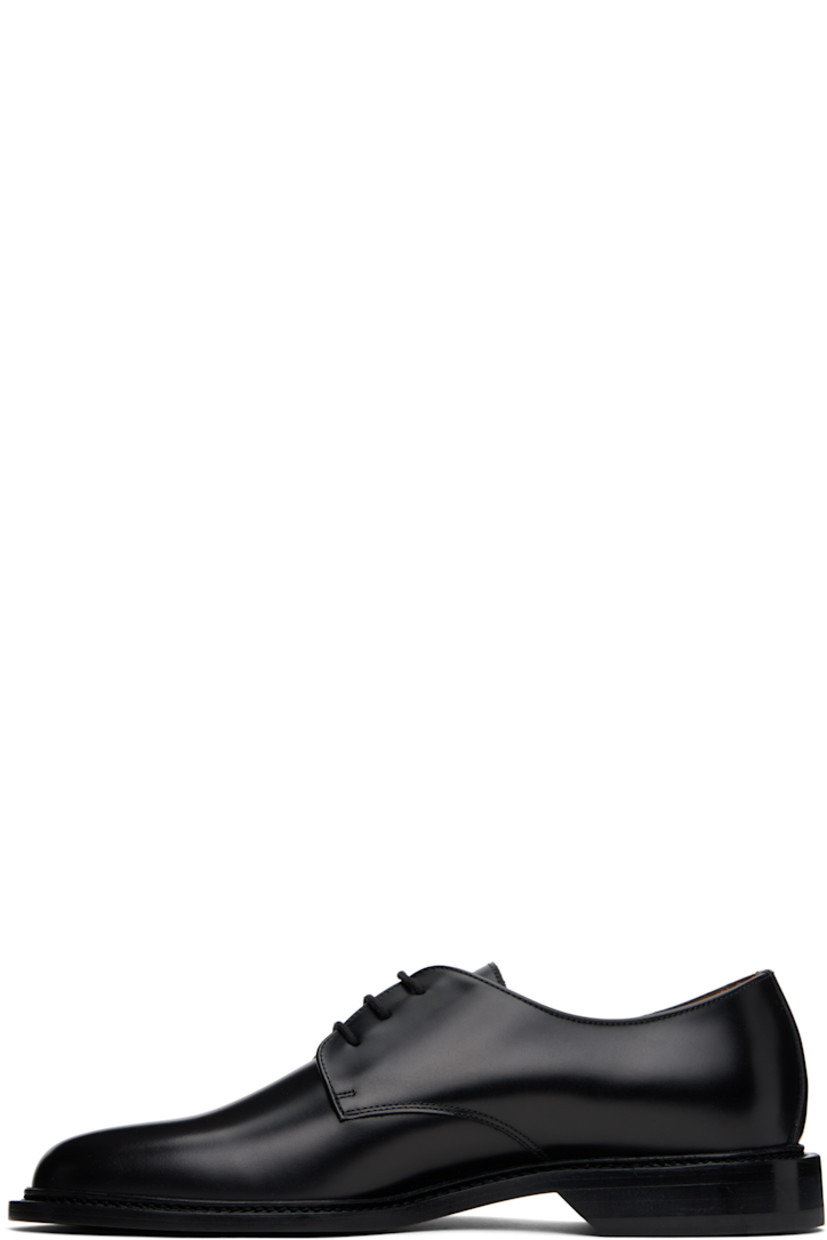 Polished leather derbys in black.

· Almond toe
· Lace-up closure
· Signature series stamp at outer side
· Buffed leather and suede lining
· Topstitching at welt
· Stacked leather heel with rubber injection
· Leather sole

Supplier color: Black