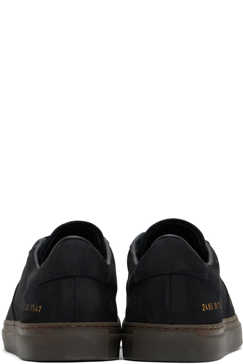 Low-top nubuck sneakers in black.

· Serrated edge at lace-up closure
· Padded collar
· Signature series stamp at outer side
· Buffed leather and suede lining
· Treaded rubber sole

Supplier color: Black