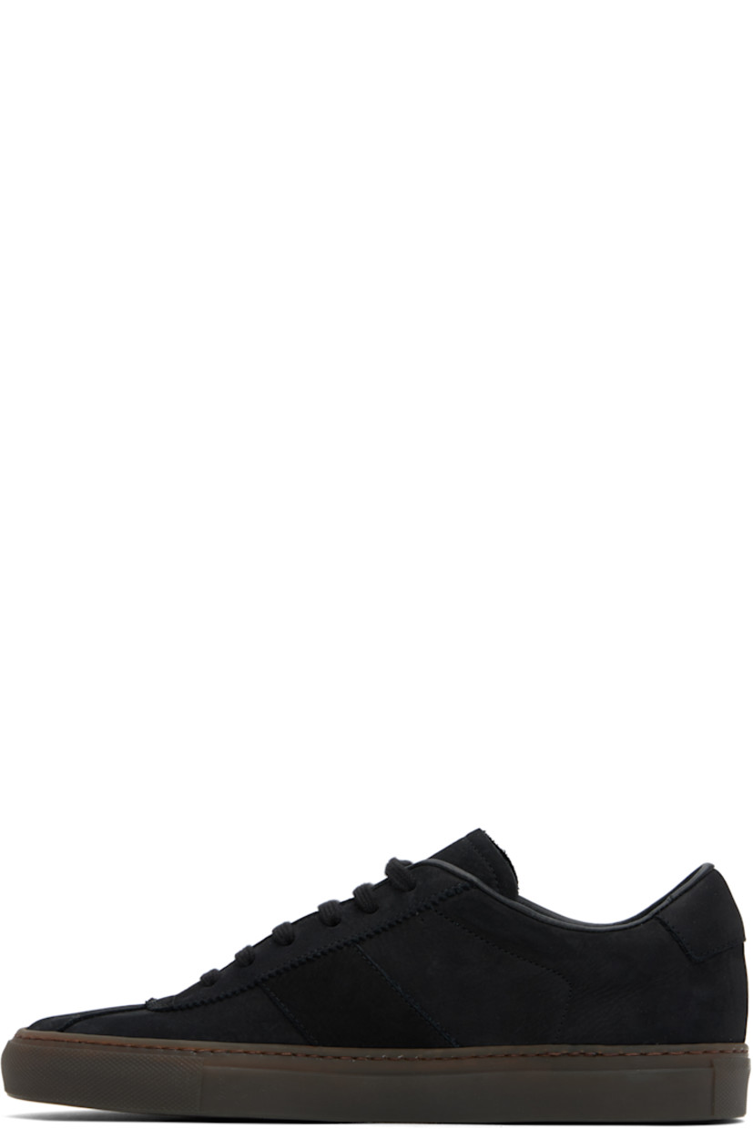 Low-top nubuck sneakers in black.

· Serrated edge at lace-up closure
· Padded collar
· Signature series stamp at outer side
· Buffed leather and suede lining
· Treaded rubber sole

Supplier color: Black