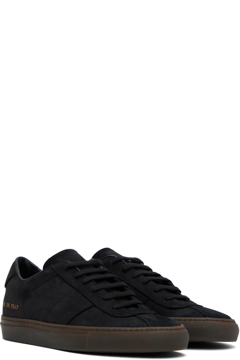 Low-top nubuck sneakers in black.

· Serrated edge at lace-up closure
· Padded collar
· Signature series stamp at outer side
· Buffed leather and suede lining
· Treaded rubber sole

Supplier color: Black