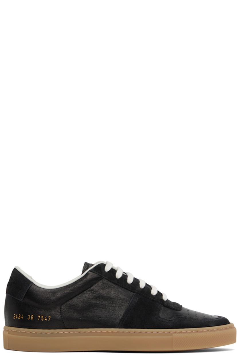 Low-top suede and waxed leather sneakers in black.

· Perforations at toe and outer side
· Lace-up closure
· Padded tongue and collar
· Signature series stamp at outer side
· Buffed leather and suede lining
· Treaded rubber sole

Supplier color: Black
