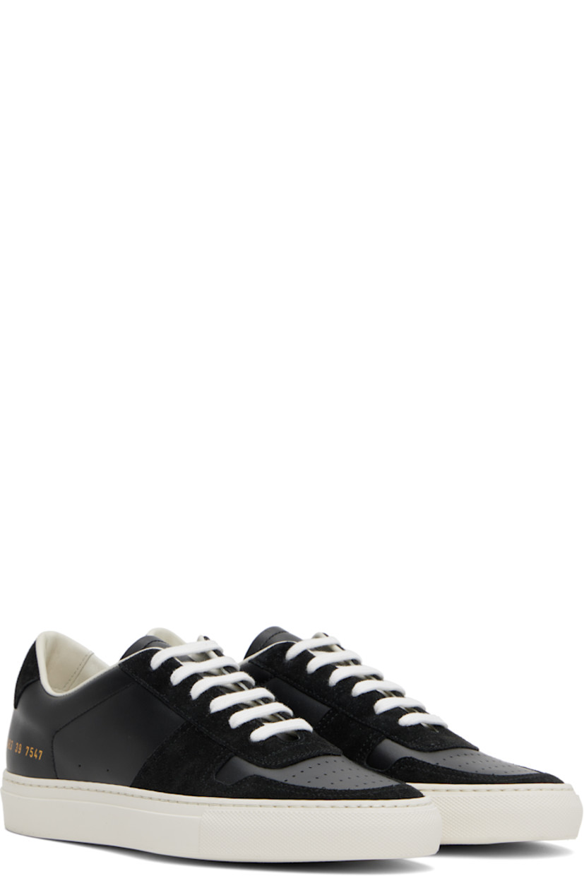 Low-top suede and buffed leather sneakers in black.

· Perforations at toe and outer side
· Lace-up closure
· Padded tongue and collar
· Signature series stamp at outer side
· Buffed leather and suede lining
· Treaded rubber sole

Supplier color: Black