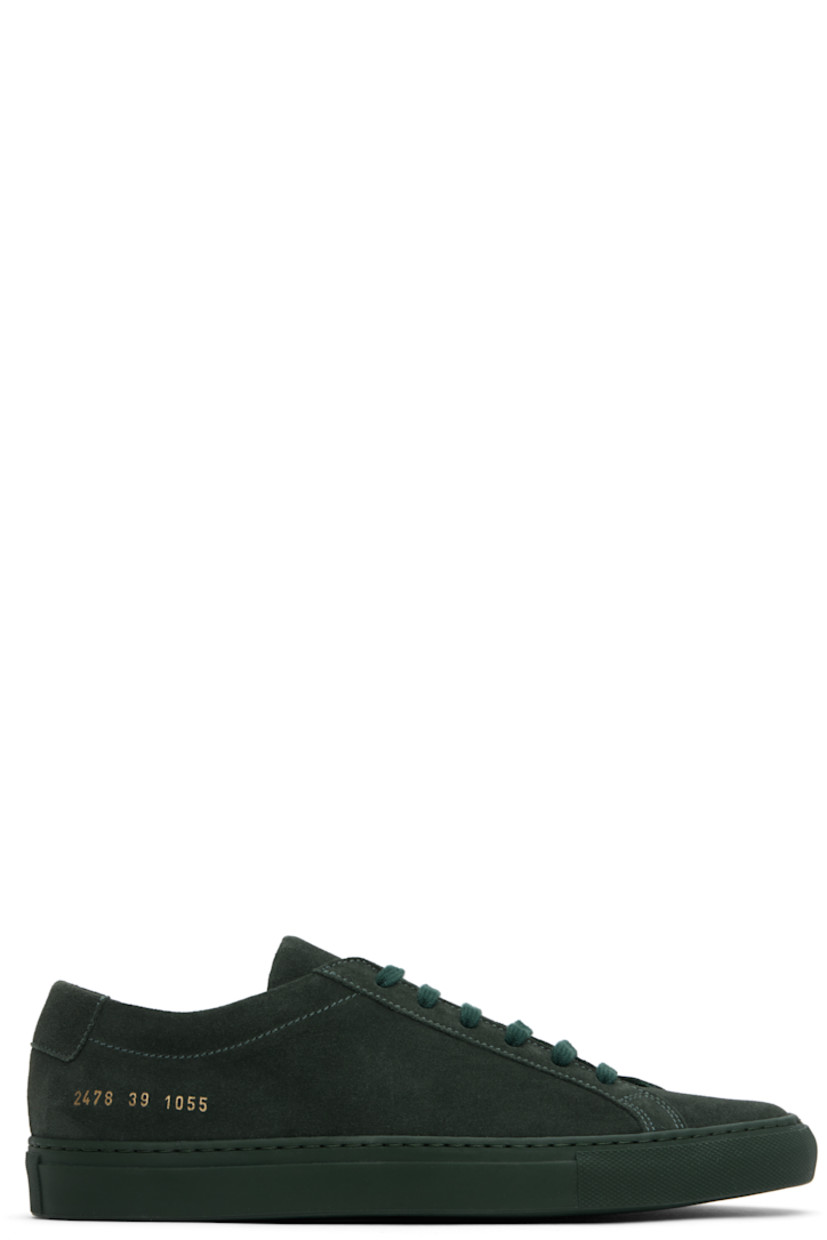 Low-top suede sneakers in green.

· Lace-up closure
· Padded tongue and collar
· Signature series stamp at outer side
· Buffed leather and suede lining
· Treaded rubber sole

Supplier color: Forest green