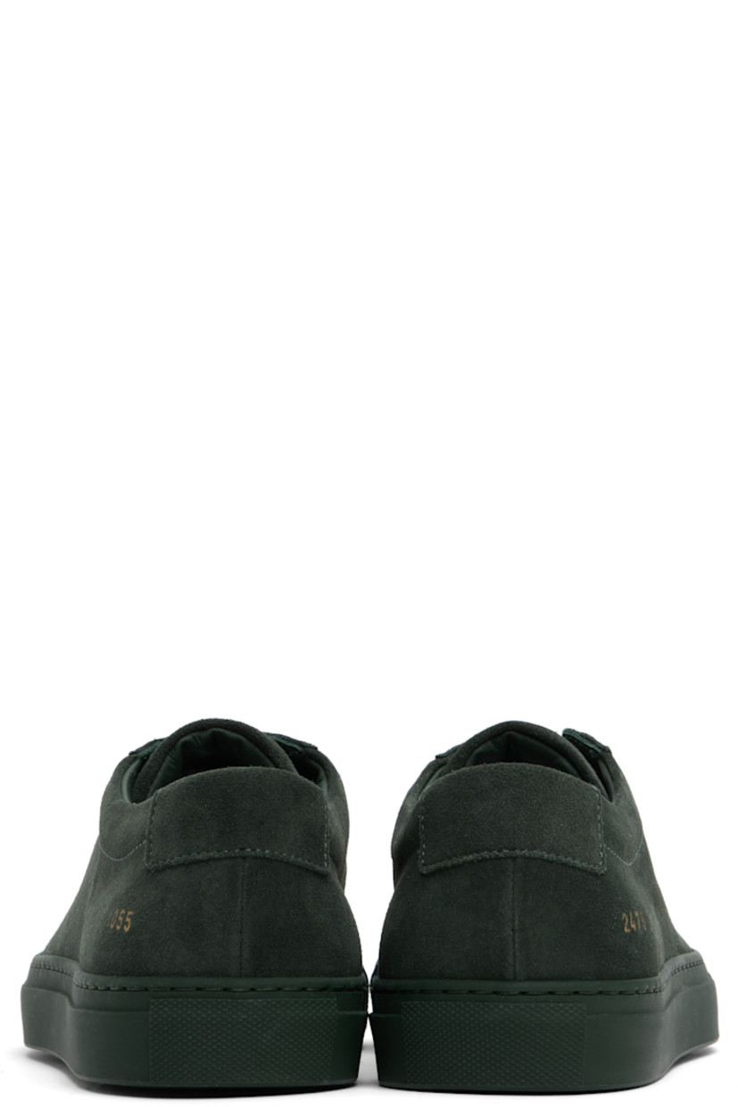 Low-top suede sneakers in green.

· Lace-up closure
· Padded tongue and collar
· Signature series stamp at outer side
· Buffed leather and suede lining
· Treaded rubber sole

Supplier color: Forest green