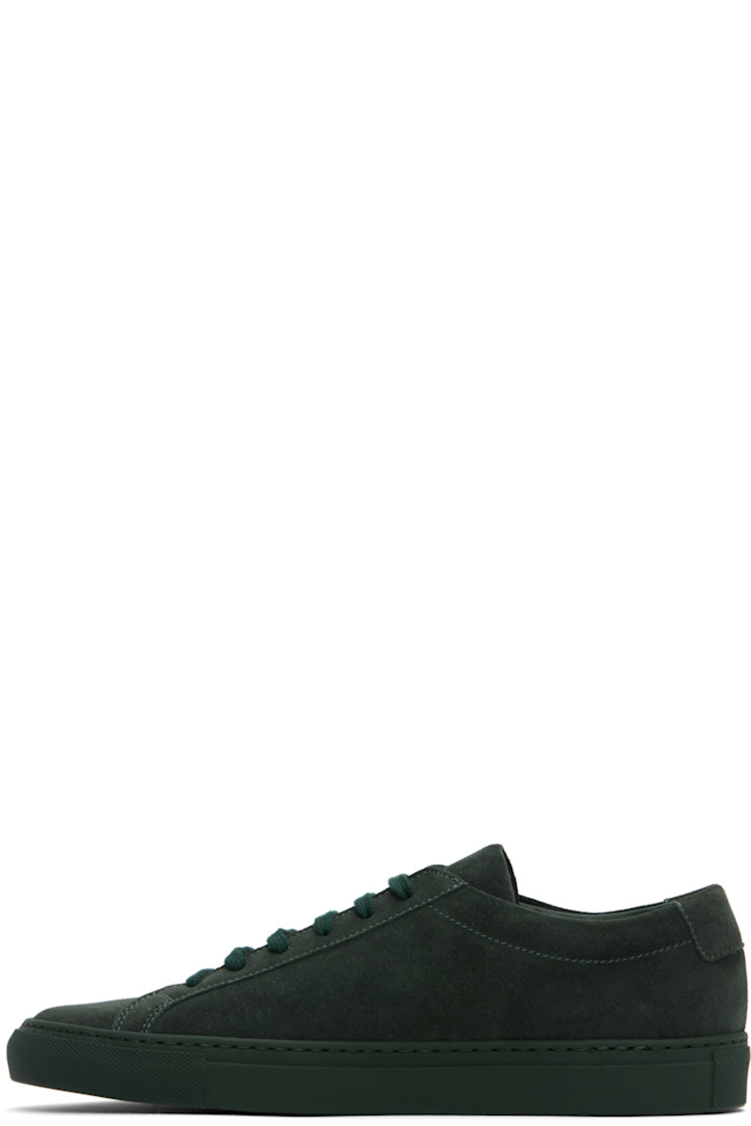 Low-top suede sneakers in green.

· Lace-up closure
· Padded tongue and collar
· Signature series stamp at outer side
· Buffed leather and suede lining
· Treaded rubber sole

Supplier color: Forest green