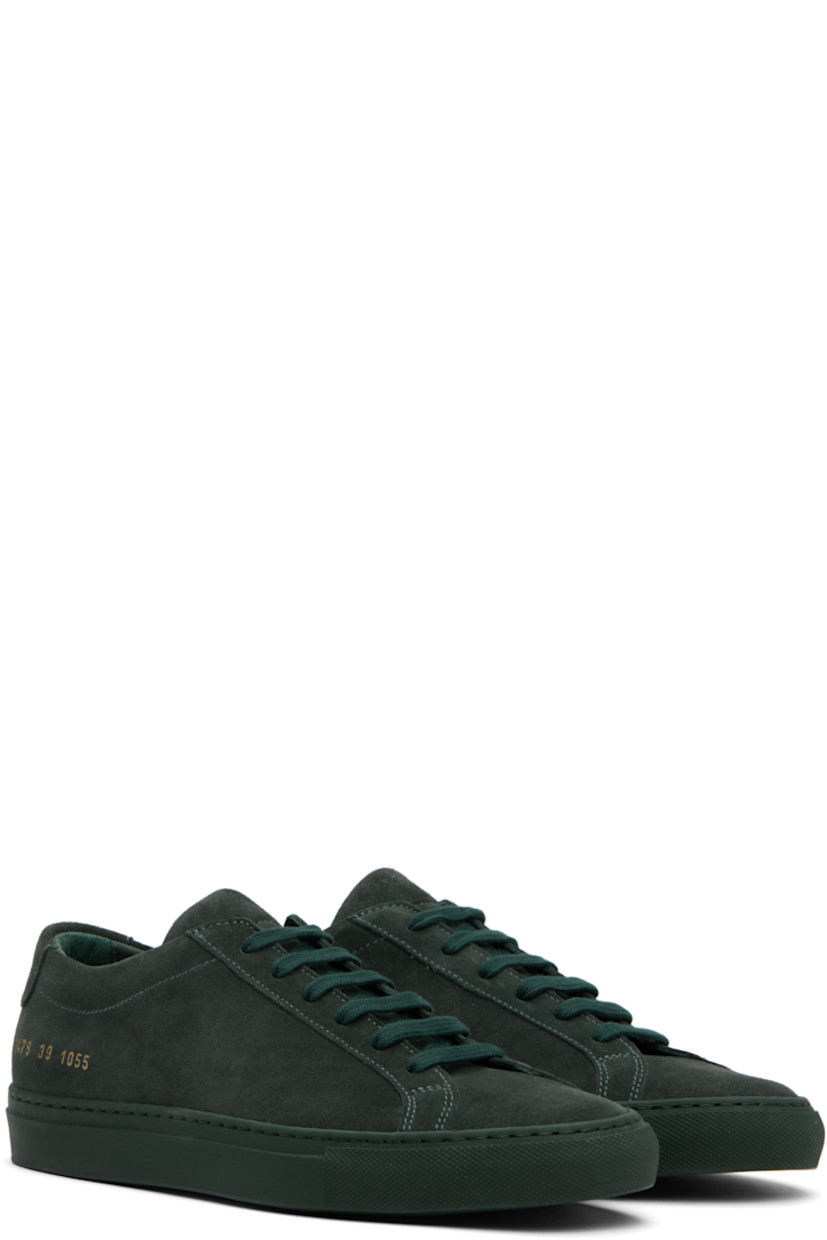 Low-top suede sneakers in green.

· Lace-up closure
· Padded tongue and collar
· Signature series stamp at outer side
· Buffed leather and suede lining
· Treaded rubber sole

Supplier color: Forest green