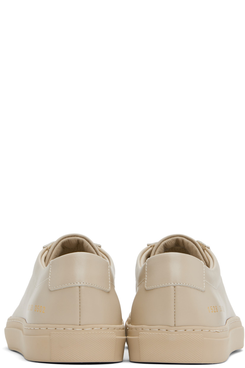 Low-top buffed leather sneakers in beige.

· Lace-up closure
· Padded tongue and collar
· Signature series stamp at outer side
· Buffed leather and suede lining
· Treaded rubber sole

Supplier color: Beige