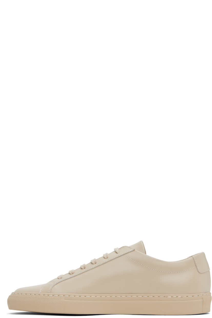 Low-top buffed leather sneakers in beige.

· Lace-up closure
· Padded tongue and collar
· Signature series stamp at outer side
· Buffed leather and suede lining
· Treaded rubber sole

Supplier color: Beige