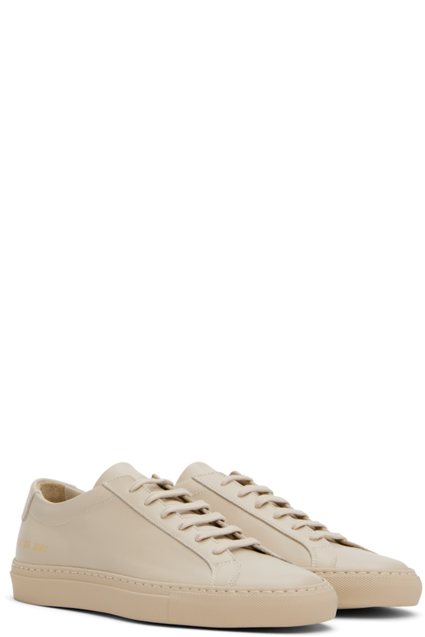 Low-top buffed leather sneakers in beige.

· Lace-up closure
· Padded tongue and collar
· Signature series stamp at outer side
· Buffed leather and suede lining
· Treaded rubber sole

Supplier color: Beige