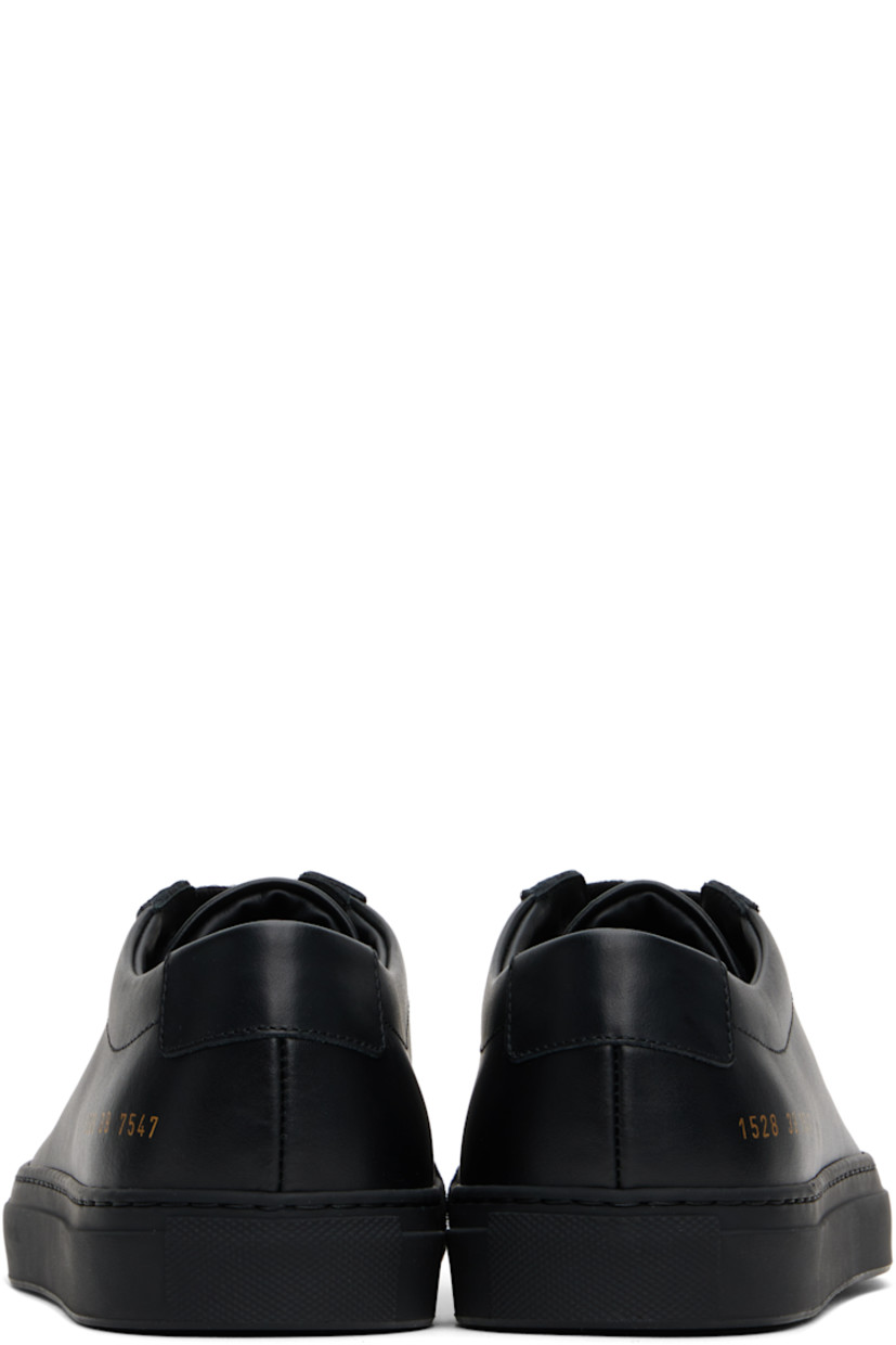 Low-top buffed leather sneakers in black.

· Lace-up closure
· Padded tongue and collar
· Signature series stamp at outer side
· Buffed leather and suede lining
· Treaded rubber sole

Supplier color: Black