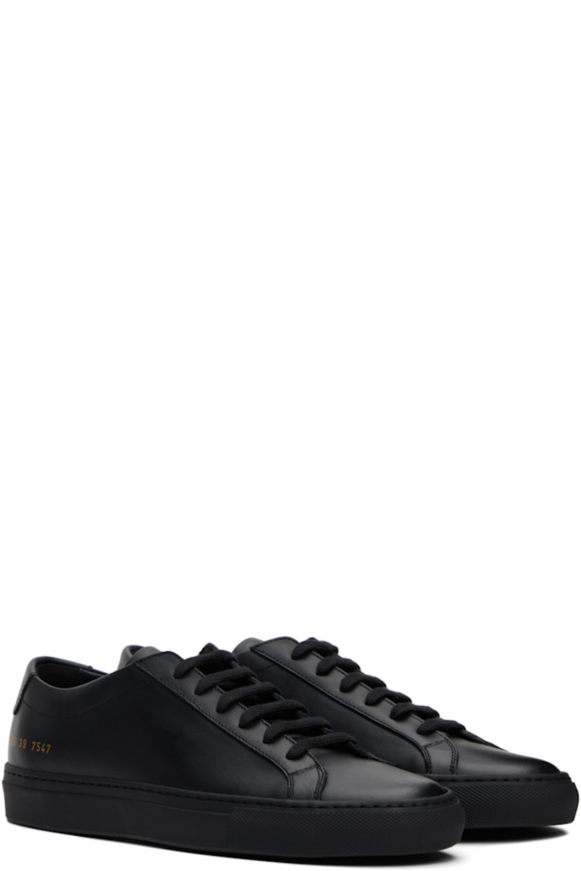 Low-top buffed leather sneakers in black.

· Lace-up closure
· Padded tongue and collar
· Signature series stamp at outer side
· Buffed leather and suede lining
· Treaded rubber sole

Supplier color: Black